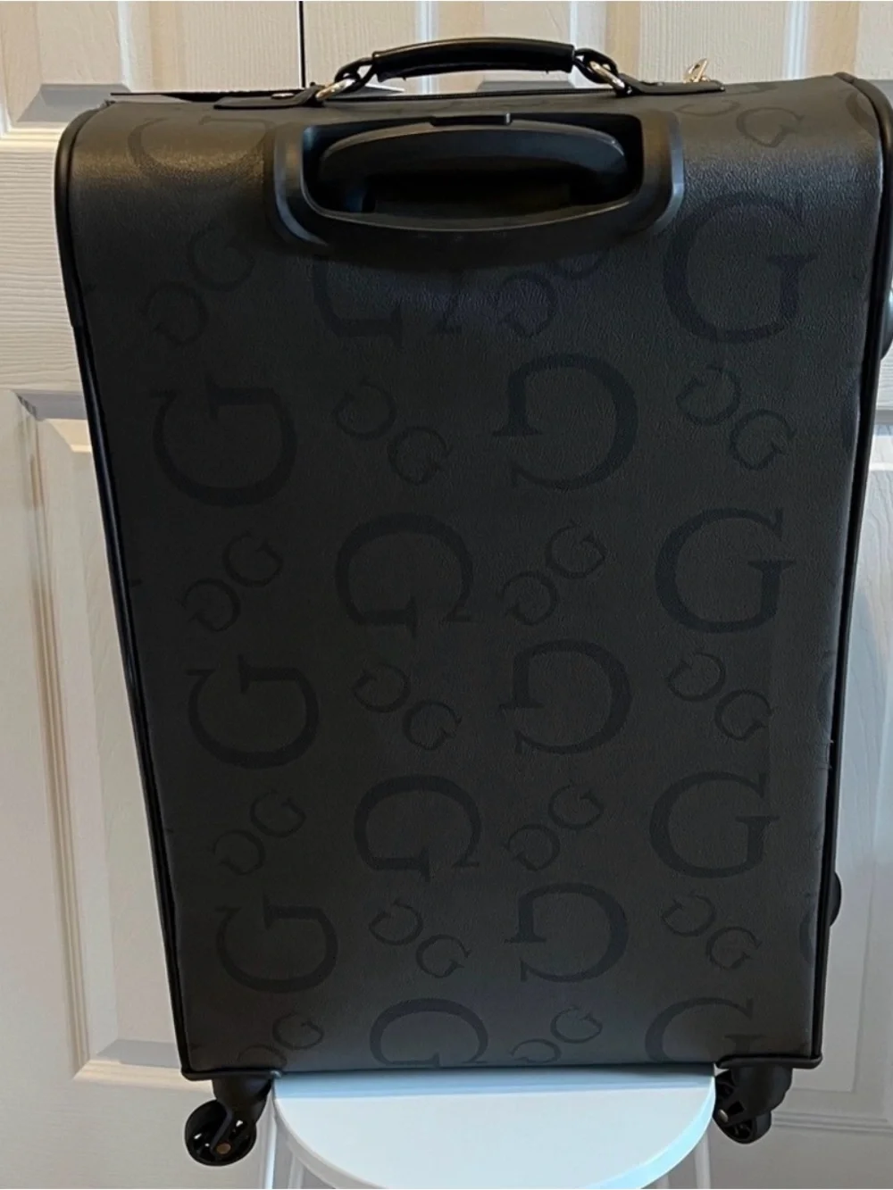 GUESS Logo Debossed Black Rolling Suitcase 24 “